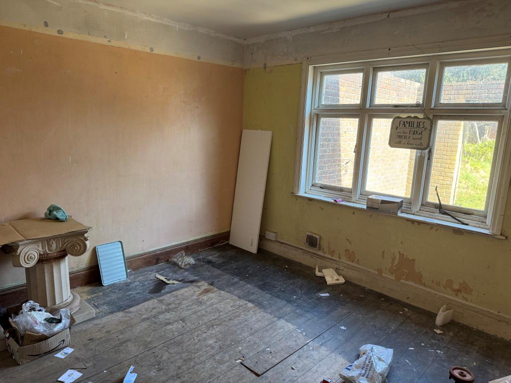 Lot: 125 - FREEHOLD SEMI-DETACHED HOUSE FOR IMPROVEMENT - A Reverse View of the Dining Room